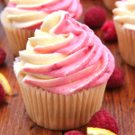 Lemon Raspberry Cupcakes by Giraffes Can Bake - Moist and tart lemon cupcakes filled with smooth lemon curd and topped with Lemon Raspberry Swirl Buttercream Frosting