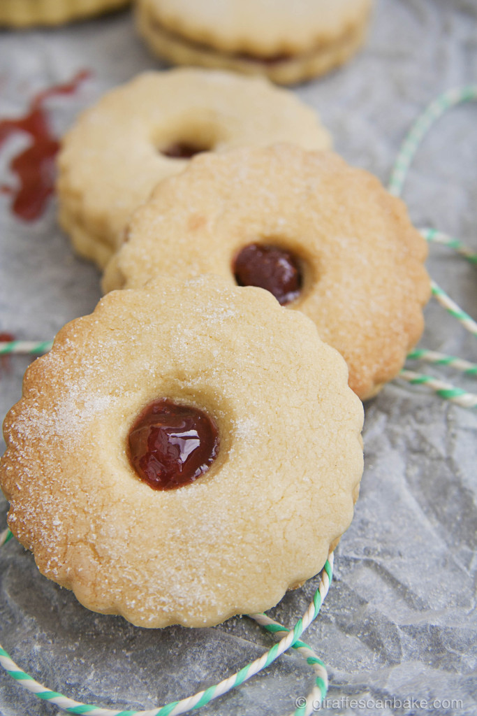 Homemade Jammie Dodgers by Giraffes Can Bake - Buttery shortbread cookies sandwiched with homemade Strawberry Jam. The classic British snack, beloved by the Eleventh Doctor. Britain's answer to the Linzer Cookie