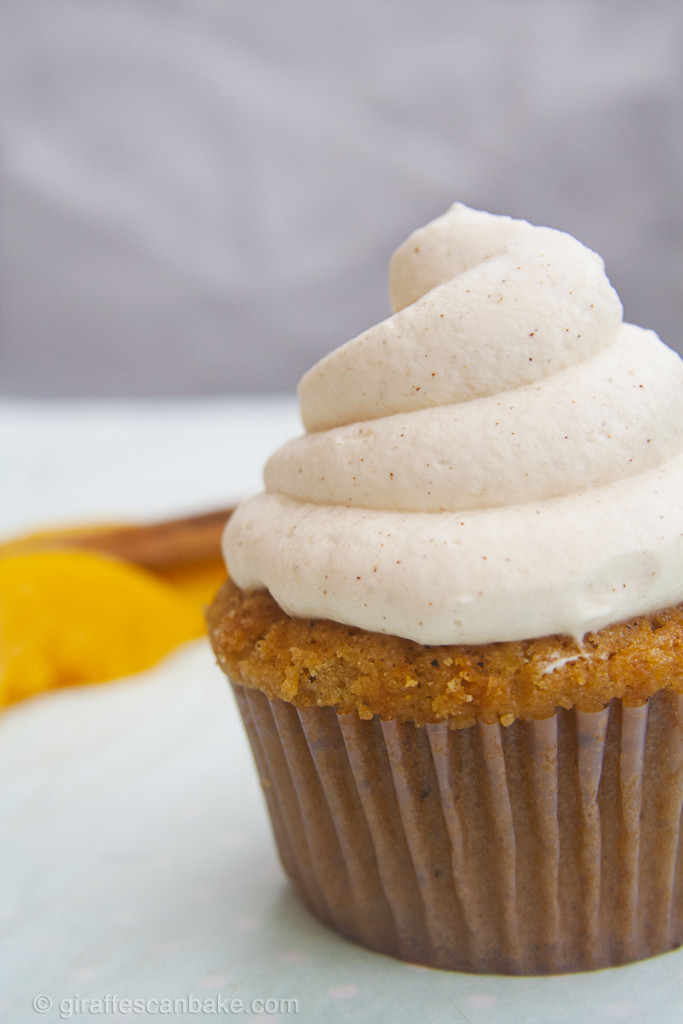 Peach Cupcakes with Cinnamon Frosting by Giraffes Can Bake - Moist peach cupcakes with a spiced peach filling, topped with a creamy and delicious Cinnamon frosting. You can used canned peaches, so you can enjoy these amazing cupcakes all year round!