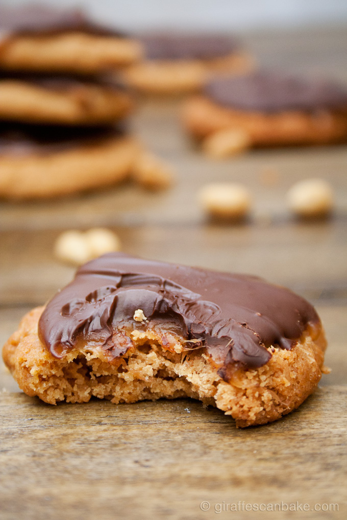 Snickers Cookies - Crumbly, flourless peanut butter cookies with gooey, chewy caramel and peanuts, topped with chocolate. They taste like a snickers bar, but better!